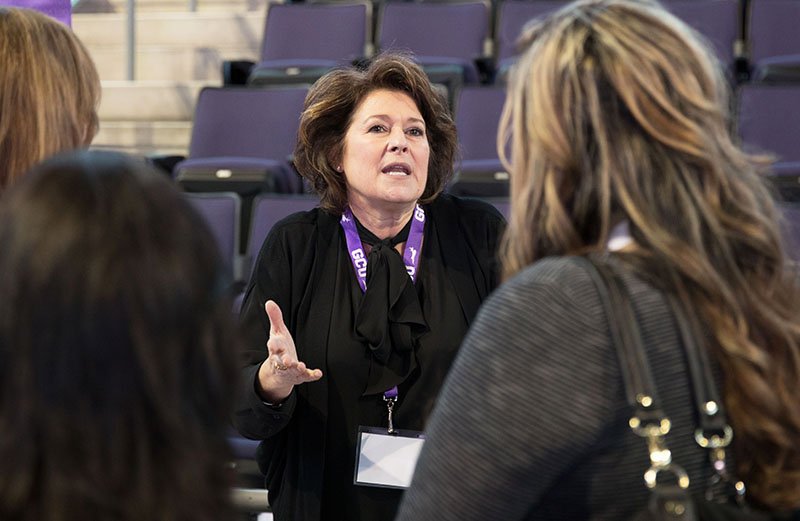 Kathryn Scott , GCU Today Learns executive director, talking with attendees of GCU's STEM INNOVATION breakfast.