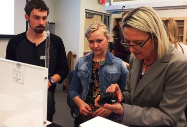 Guske and Raney get help from instructor Dina Higgins in a new-style GCU engineering class.